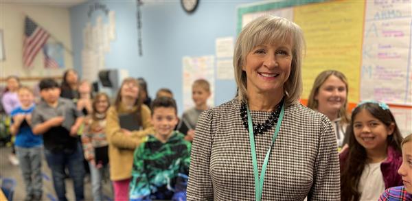 Teacher with Students behind Teacher with Students behind
